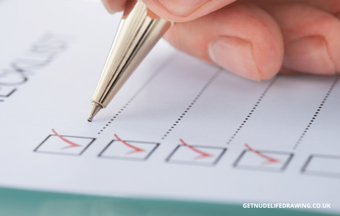 Person writing a checklist
